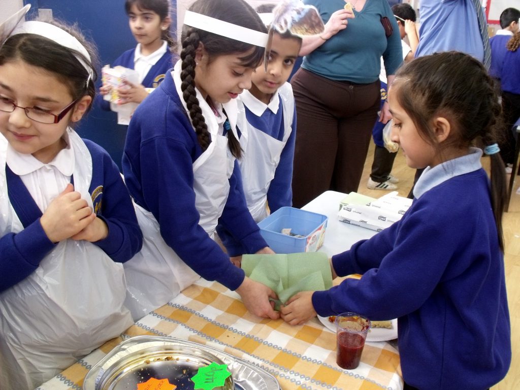 Primary school pupils taking part in a hands-on classroom learning activity