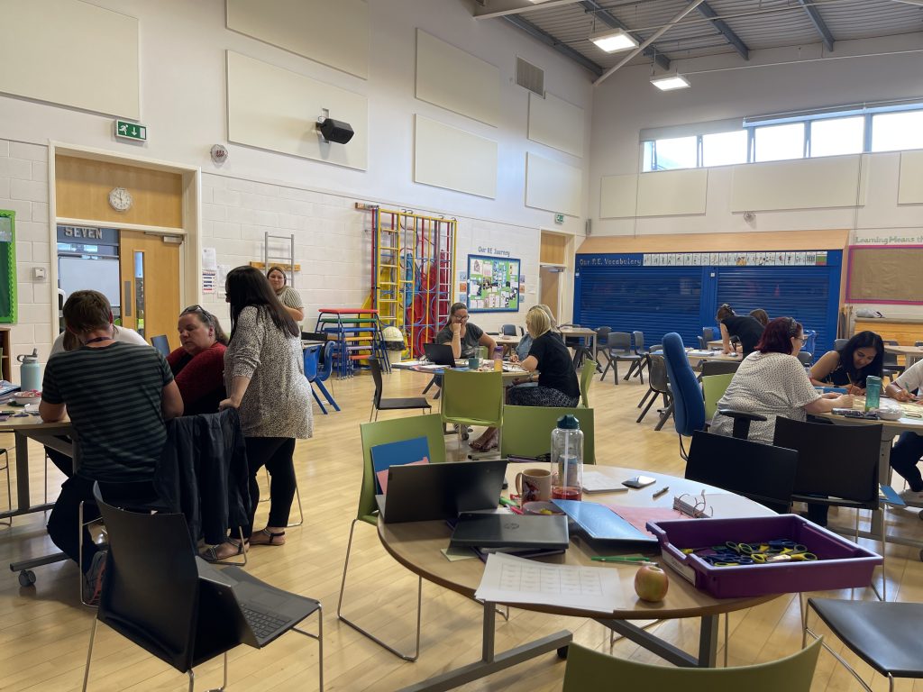 Teacher guiding pupils through a structured activity