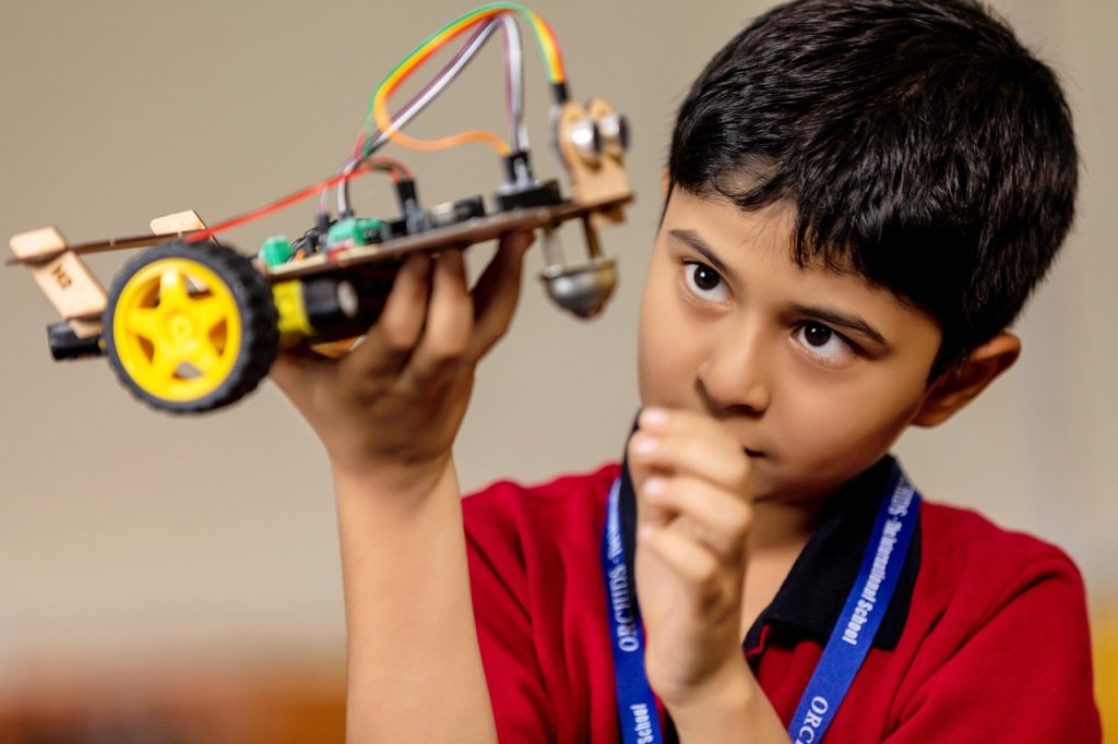 Children engaged in reading, writing and problem-solving